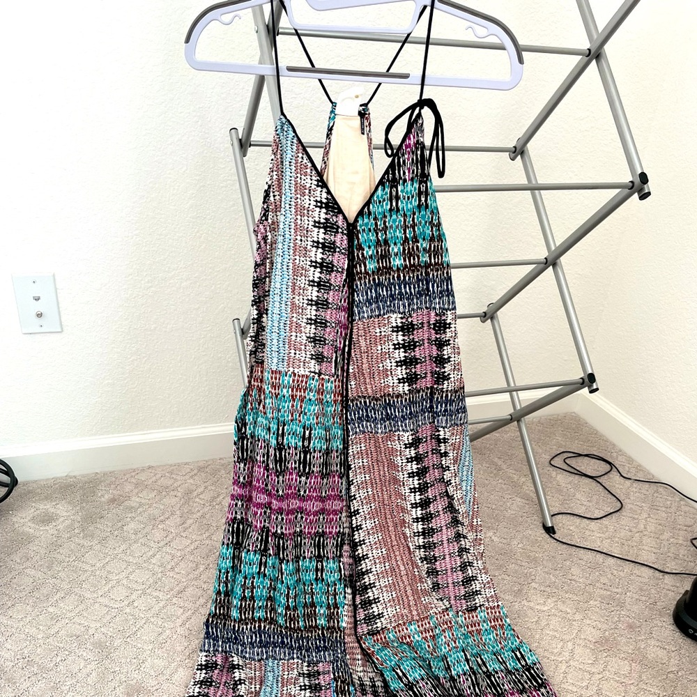 Floaty dress. Spaghetti straps adjustable. Asymmetrical hem line. A-line style